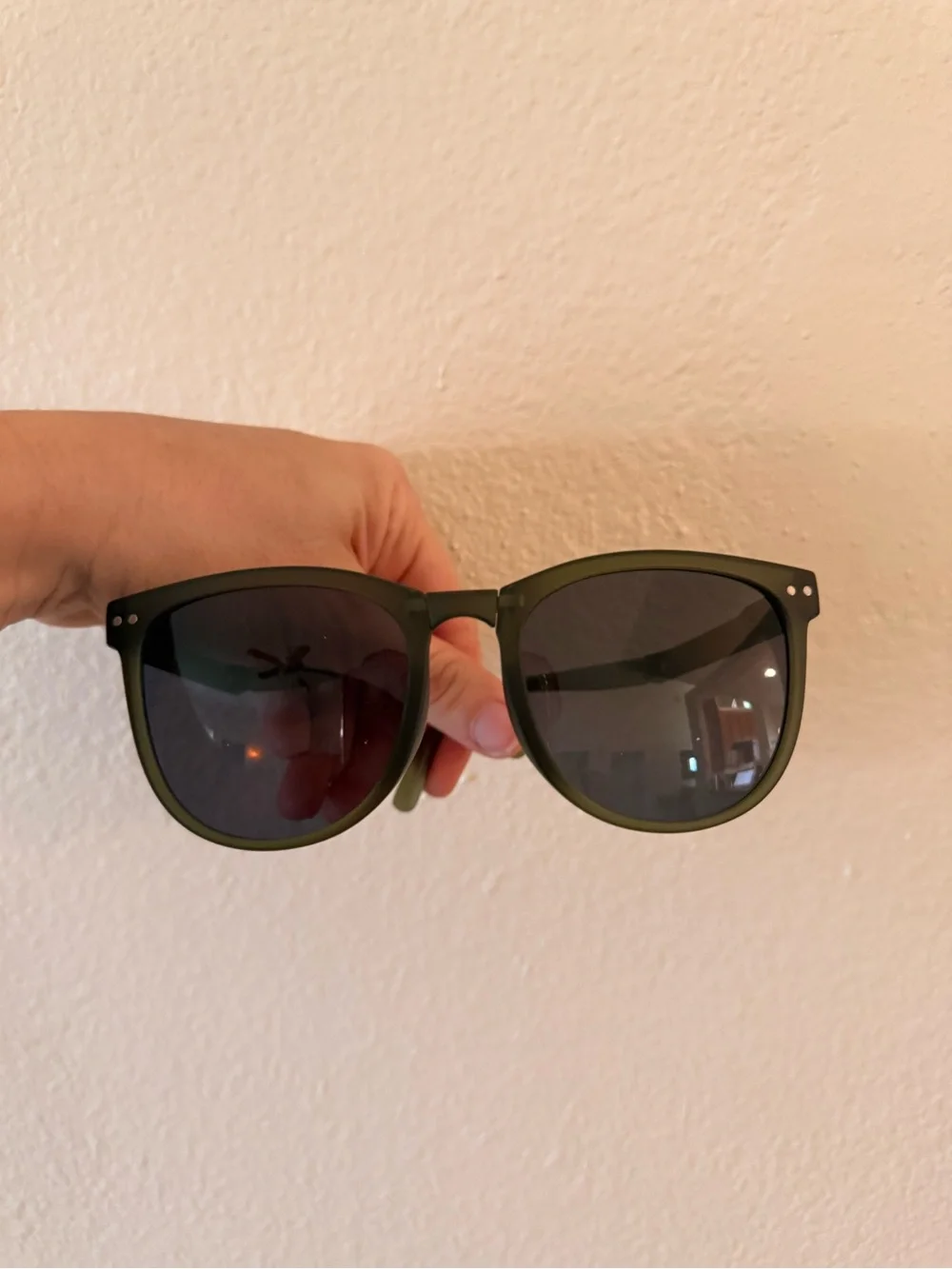 Green sunglasses with black lenses